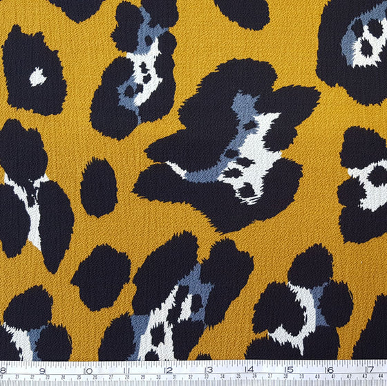 Polyester Animal Print on Mustard Background - The Fabric Bee