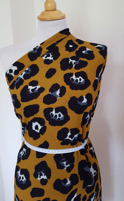 Polyester Animal Print on Mustard Background - The Fabric Bee