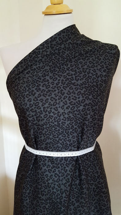 Jersey/Stretch Fabric Black Leopard Print on Grey Background - The Fabric Bee